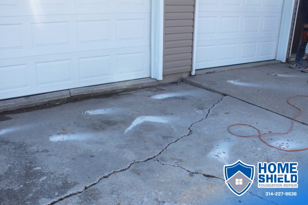 Sunken sidewalk slab before polyjacking in O’Fallon, Missouri